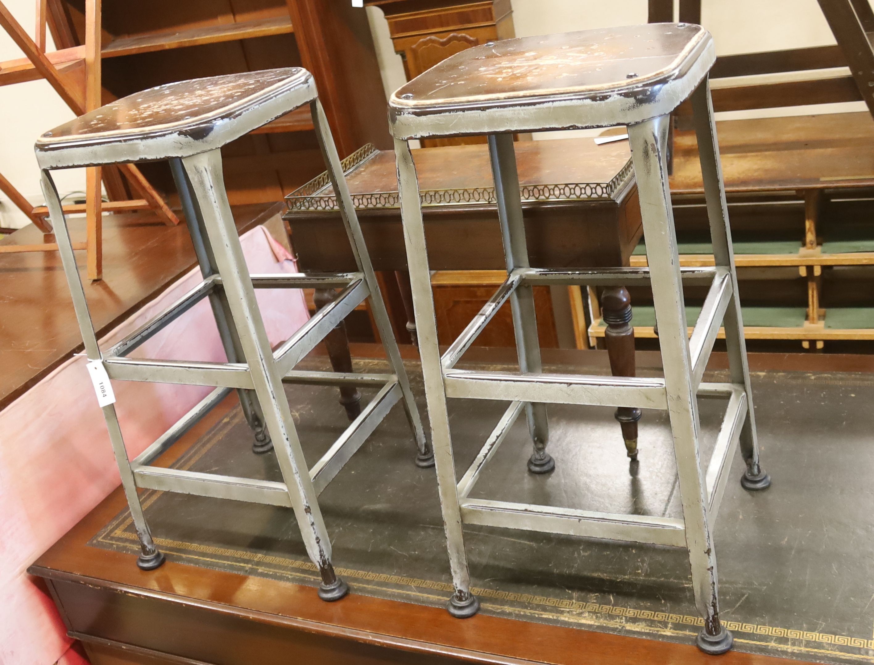 A pair of industrial style steel stools, height 74cm